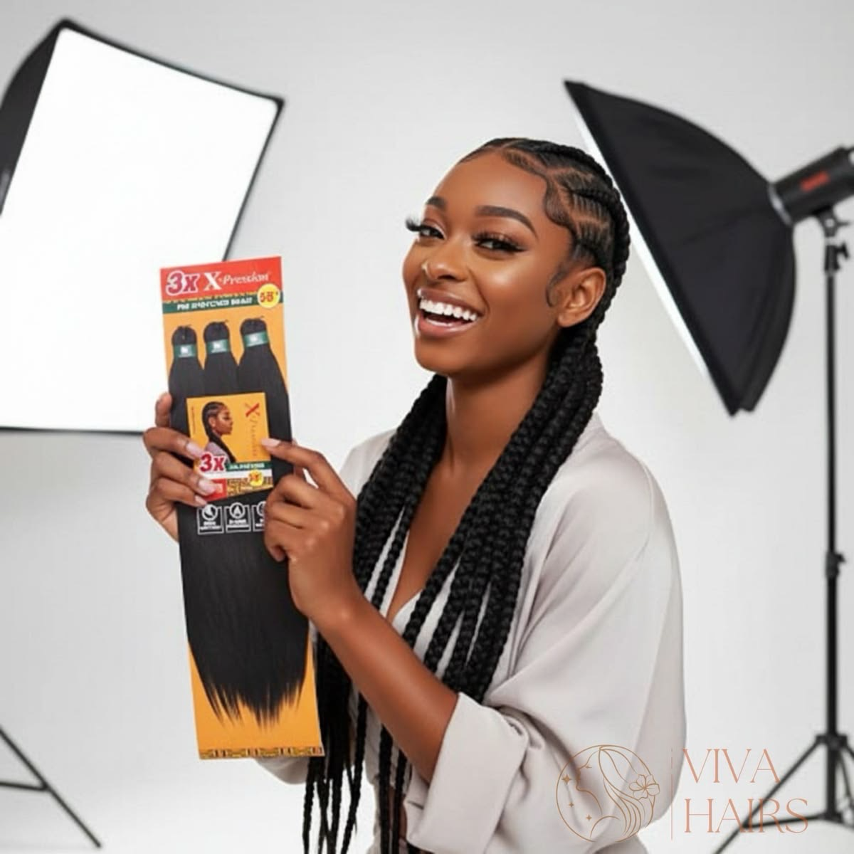 Model holding a pack of pre-stretched braiding hair in a studio